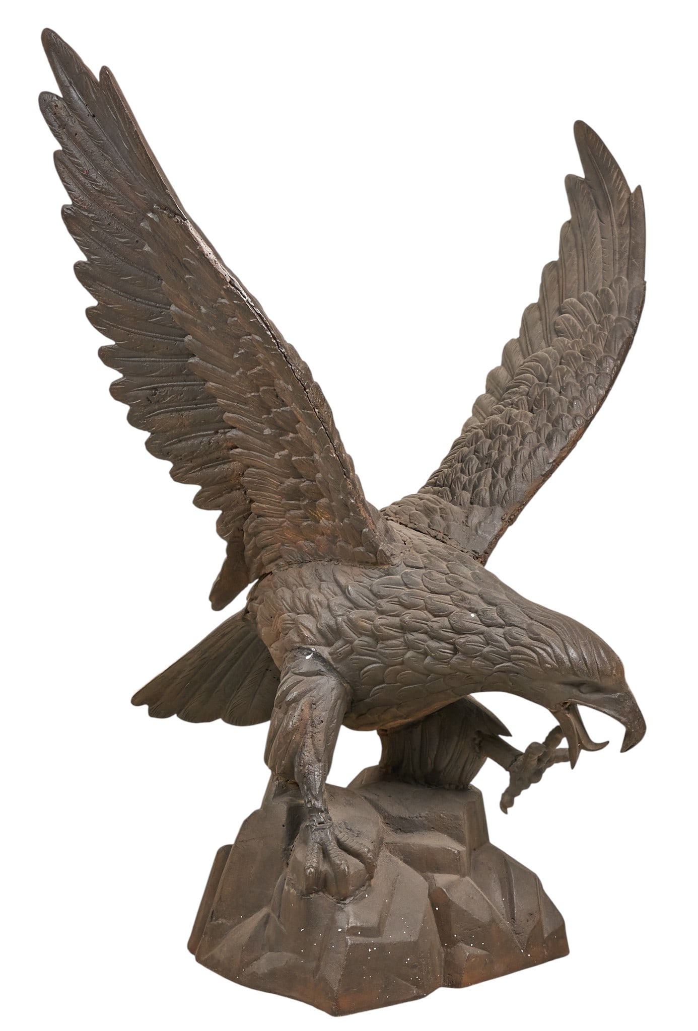 Cast Iron Eagle Statue: Cast iron sculpture of eagle atop rocky outcropping, freestandingheight 45.5 in. x width 35.5 in. x depth 30 in.Provenance: Property from a home in the Alamo Heights neighborhood of San Antonio, Texas