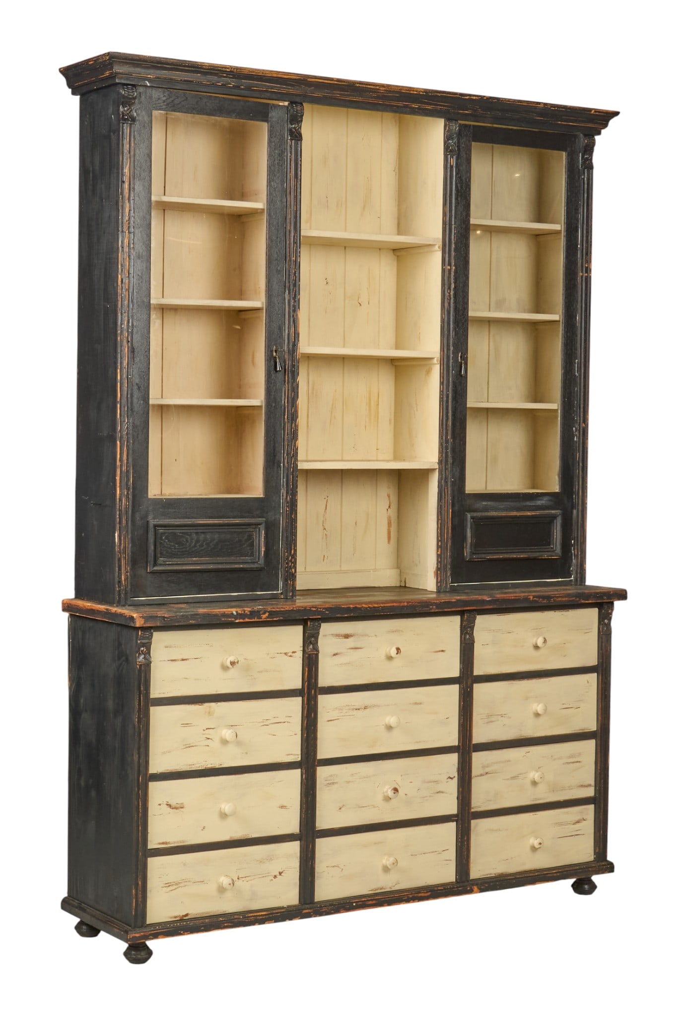 Rustic Apothecary Cabinet: Over-eight-foot-tall rustic, two-piece apothecary cabinet, with top section with two glass-front doors and shelving, supported on base with twelve drawers, distressed black and off-white paint