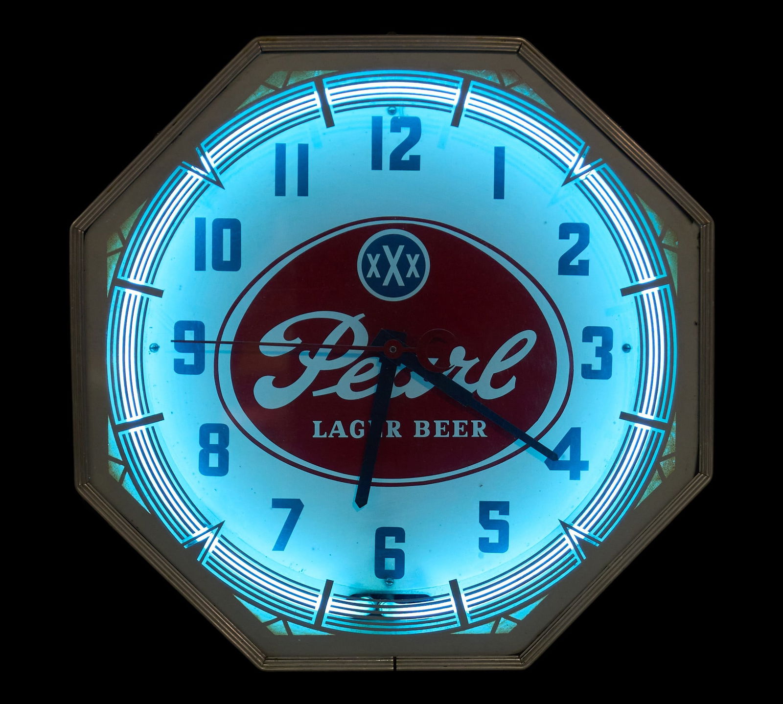 Pearl Lager Beer Light Up Clock: Vintage Pearl Lager Beer neon clock, circa 1960s, in working conditionheight 18 in. x width 18 in. x depth 7 in. Provenance: Property from a home in Seguin, TexasCondition: neon takes few