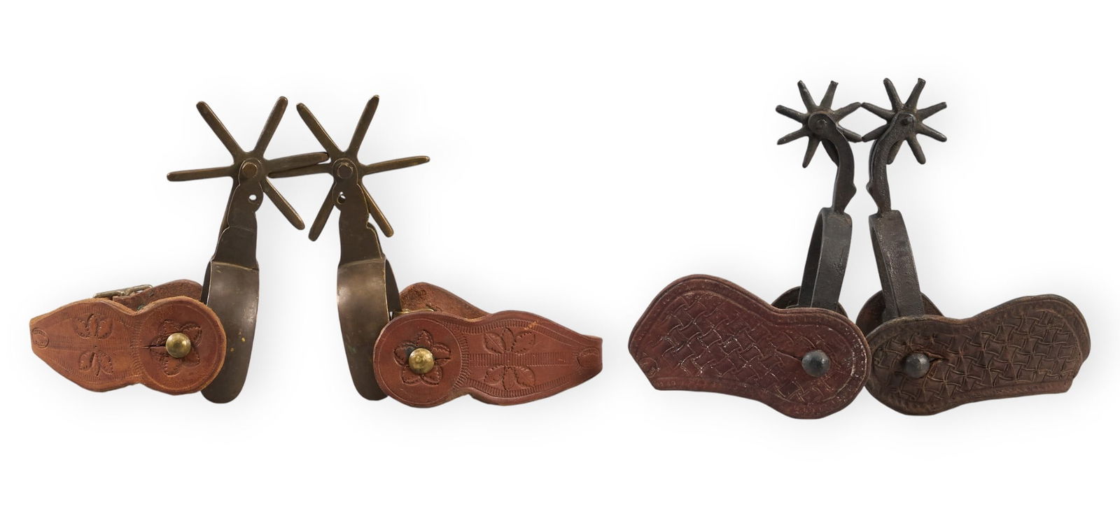 (2) Pairs of Mexican Spurs: Two pairs of Mexican spurs with tooled leather heel straps spur length 7 in. / largest heel width 3.5 in. / largest rowel diameter 3.75 in. / largestProvenance: Property from a San