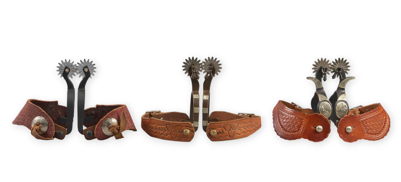 (3) Pairs of Contemporary Spurs: Three pair of contemporary cowboy spurs with leather heal straps spur length 6.5 in. / largest heel width 3.75 in. / largest rowel diameter 2 in. / largest Proven
