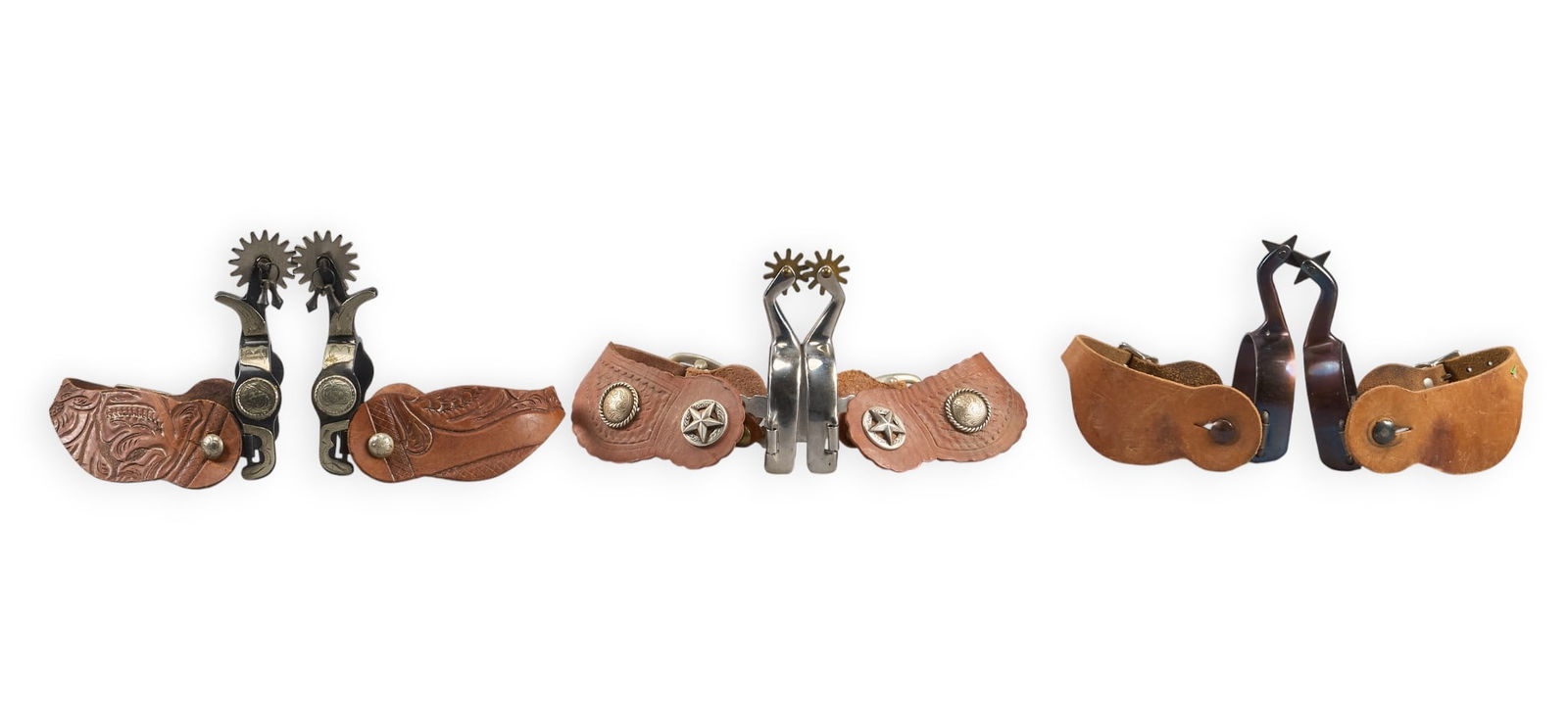 (3) Pairs of Contemporary Spurs: Three pairs of contemporary cowboy spurs with leather heel straps spur length 6 in. / largestheel width 3 in. / largestrowel diameter 2 in. / largest Provenance: Property from a San Ant