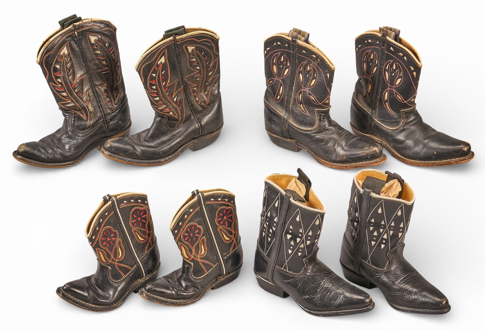(4) Pairs of Baby Cowboy Boots: Four pairs of leather baby cowboy boots height 8 in. x width 8 in. x depth 3 in. / largest Provenance: Property from a home in San Antonio, Texas