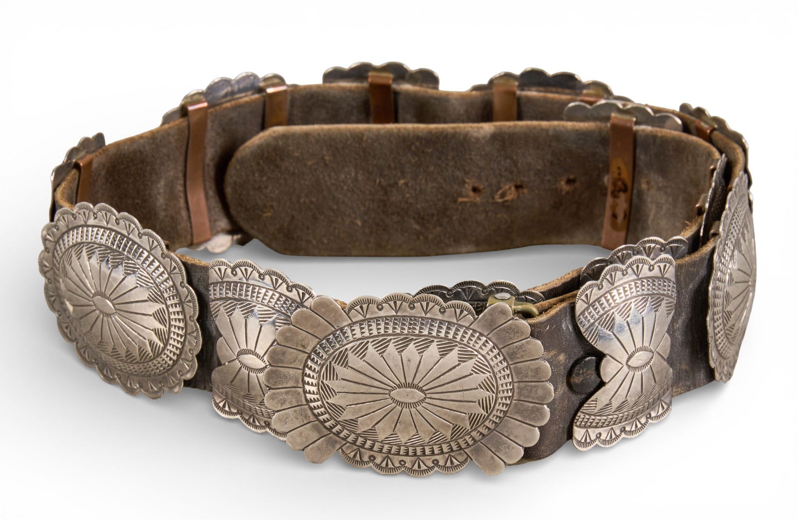 Sterling Silver Concho Belt: Sterling silver concho belt, with thirteen conchos and buckle on brown leather belt, size 28, marked "DJ" Length: 31.5 in.Total weight: 8.545 ozt