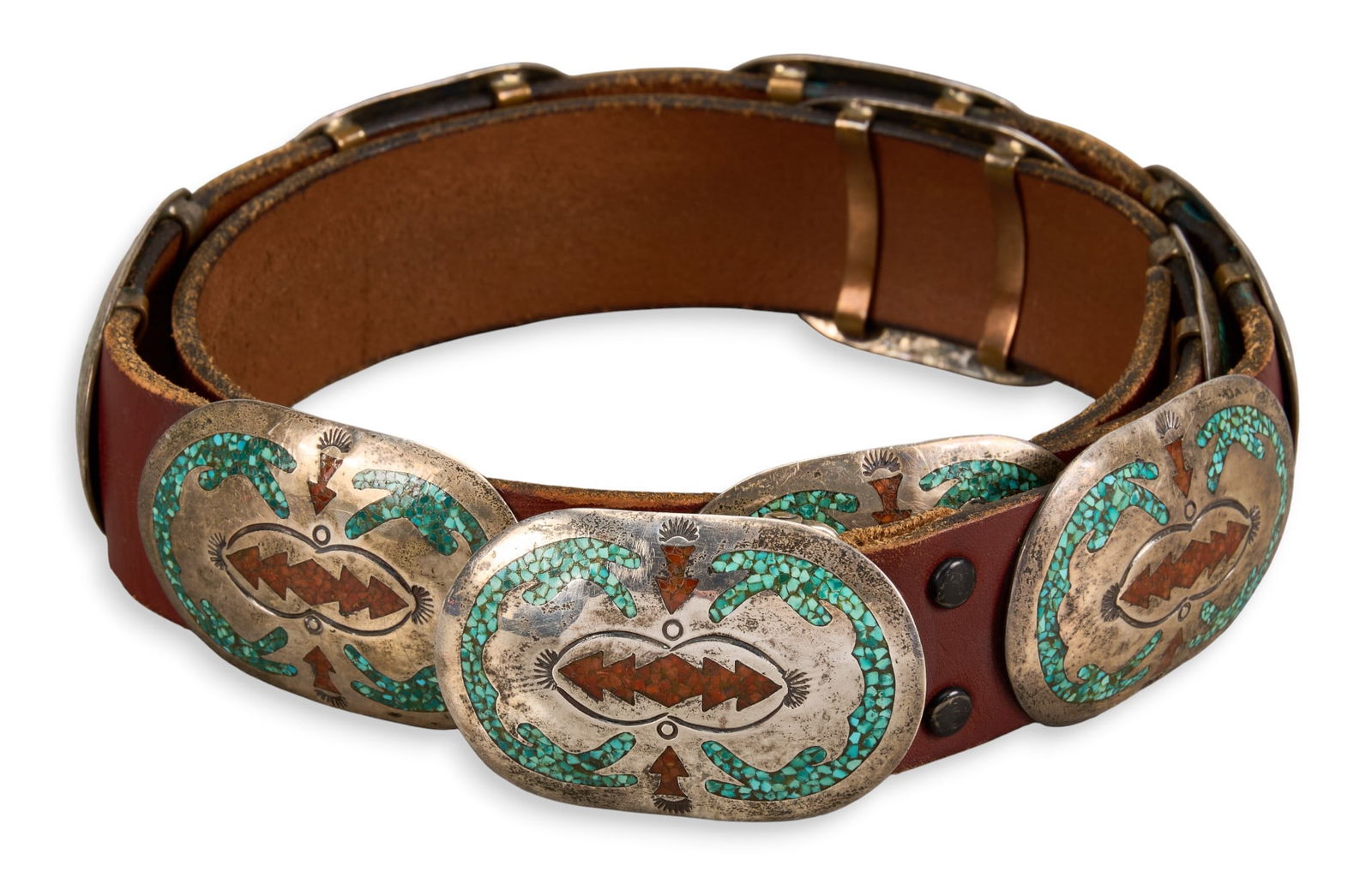 Native American Sterling Silver Chip Inlay Concho Belt: Native American sterling silver concho belt featuring turquoise and coral chip inlay to each concho, with ten conchos on brown leather belt, buckle marked "CJ" Length: 49.5 in.Total wei