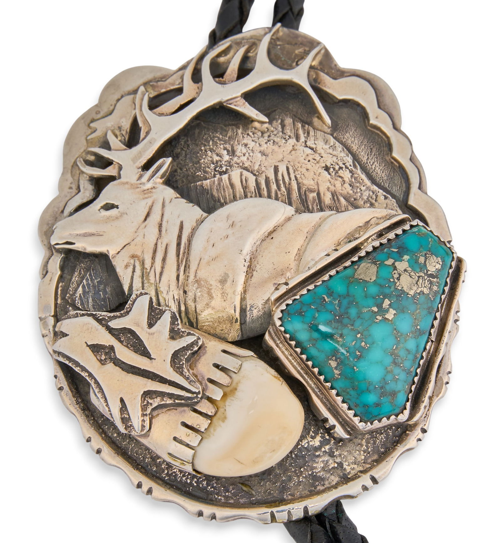 Dan Nieto, Elk Bone & Turquoise Bolo Tie: Dan Nieto, sterling silver bolo tie with inlaid turquoise and elk bone, depicting elk and mountain motif, marked "Sterling" Length: 46 in.Pendant: 3 in. x 2.5 in.Total weight: 3.295 ozt Provenance: Pr