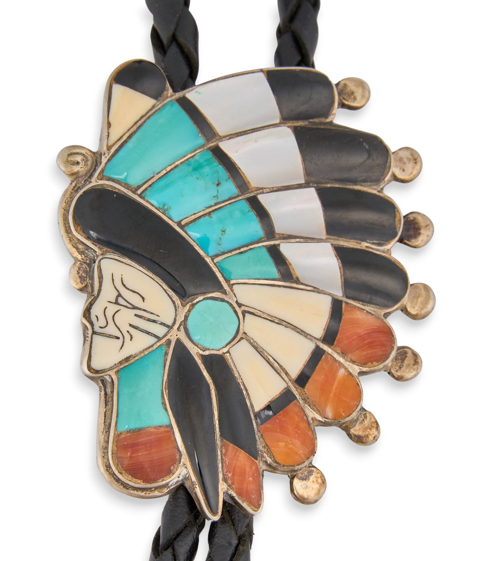Navajo Sterling & Multi-Stone Inlay Bolo Tie: Navajo sterling silver bolo tie depicting chief's head, featuring multi-stone inlay, on braided black leather cord Length: 37 in.Total weight: 1.04 ozt