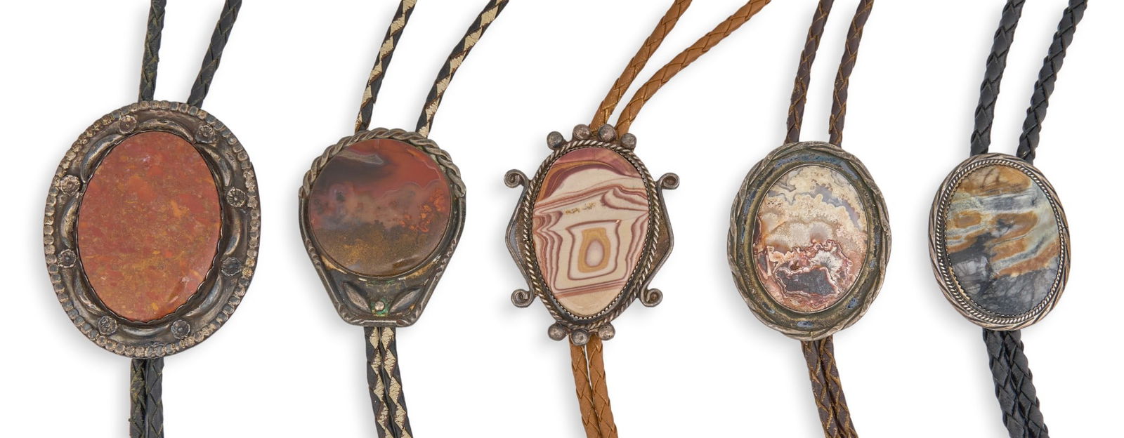 (5) Navajo Sterling & Agate Bolo Ties: Group of five sterling silver bolo ties with inlaid agate and gemstone to pendants, featuring twisted rope details, on braided leather cords in various colors Length: 41 in. / longestPendant: 2.7