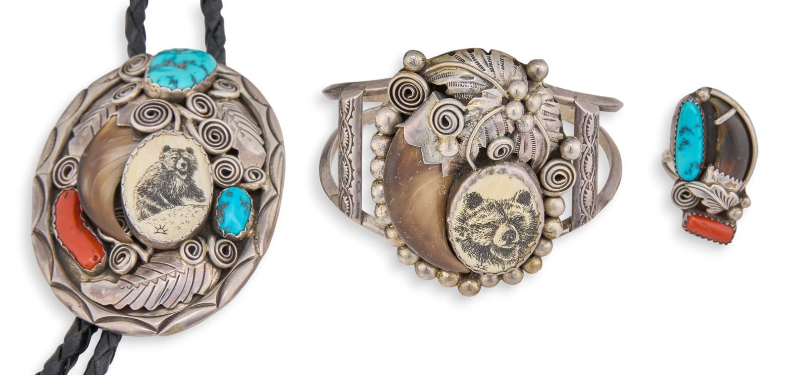 Sterling Silver Scrimshaw & Bear Claw Jewelry Suite: Scrimshaw and claw jewelry suite to include sterling silver bolo tie and cuff, each with inlaid turquoise, coral, bear claw, and etched scrimshaw depicting a bear, and matching ring with inlaid coral,