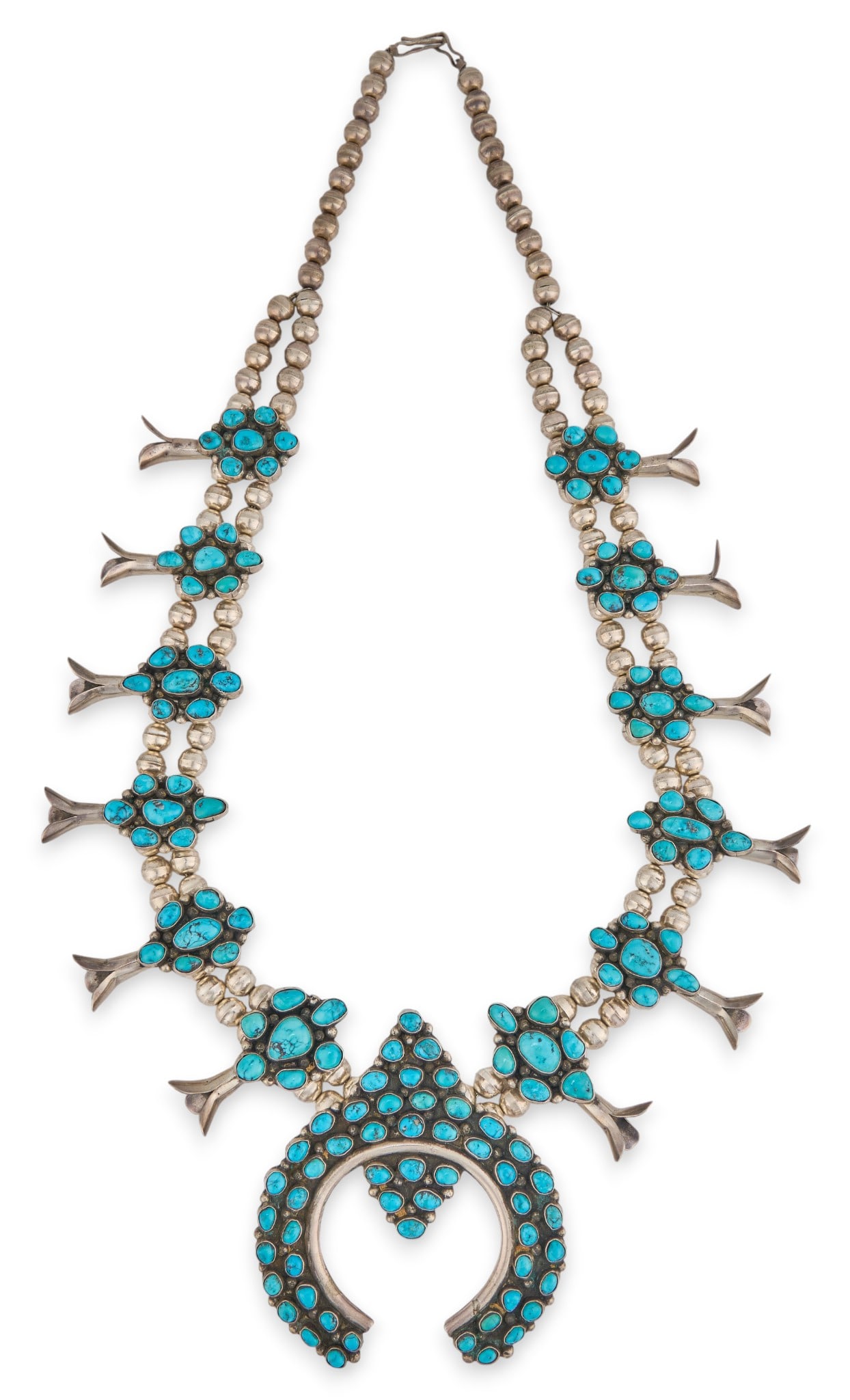 Lupe Sandoval, Navajo Turquoise Cluster Squash Blossom: Lupe J. Sandoval, Navajo sterling silver two-strand squash blossom necklace, with inlaid cluster turquoise cabochons, with hook and eye closure, signed "Lupe J. Sandoval" Length: 26 in.Total