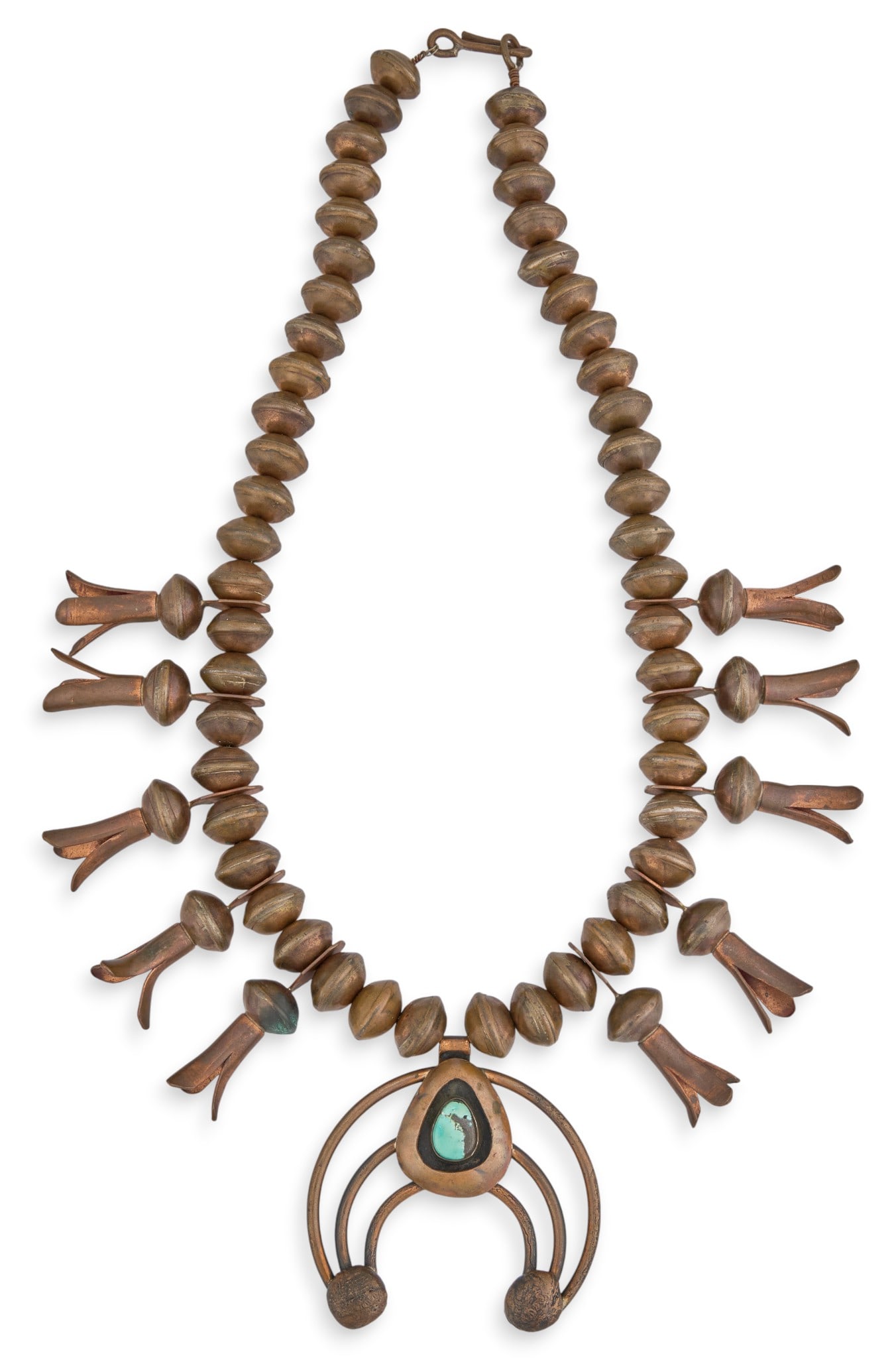 Copper & Turquoise Squash Blossom Necklace: Copper squash blossom necklace with single inlaid turquoise stone to naja, with hook and eye closure Length: 22.5 in.Total weight: 452.9 g Provenance: Property from the home of a former San Antonio, T