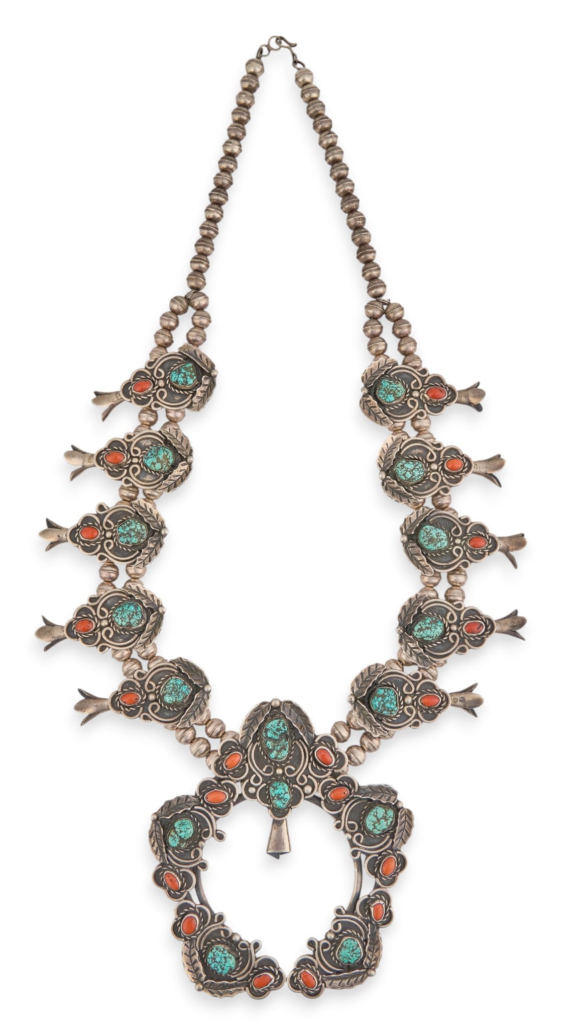 Vintage Turquoise & Coral Squash Blossom: Vintage sterling silver squash blossom necklace, with inlaid turquoise and coral cabochons throughout, featuring leaf motifs, with hook and eye closure, circa 1970s Length: 25 in.Total weight: 8.085 o