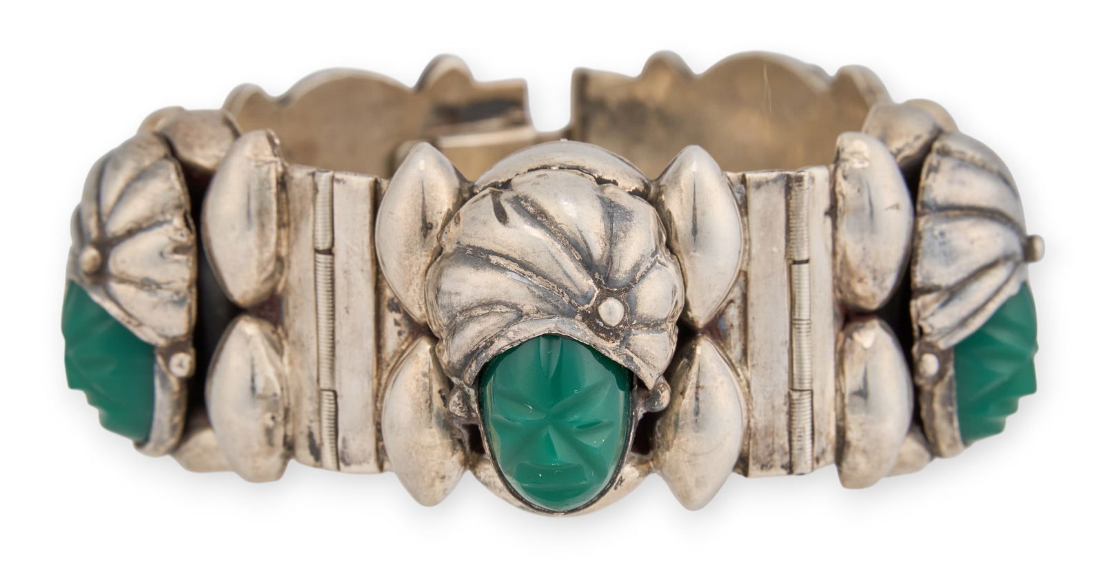 Vintage Mexican Sterling Hinged Bracelet: Vintage Mexican sterling silver hinged bracelet with carved Aztec faces, marked "Mexico Sterling"Length: 7 in. Total weight: 1.98 oztProvenance: Property from the personal