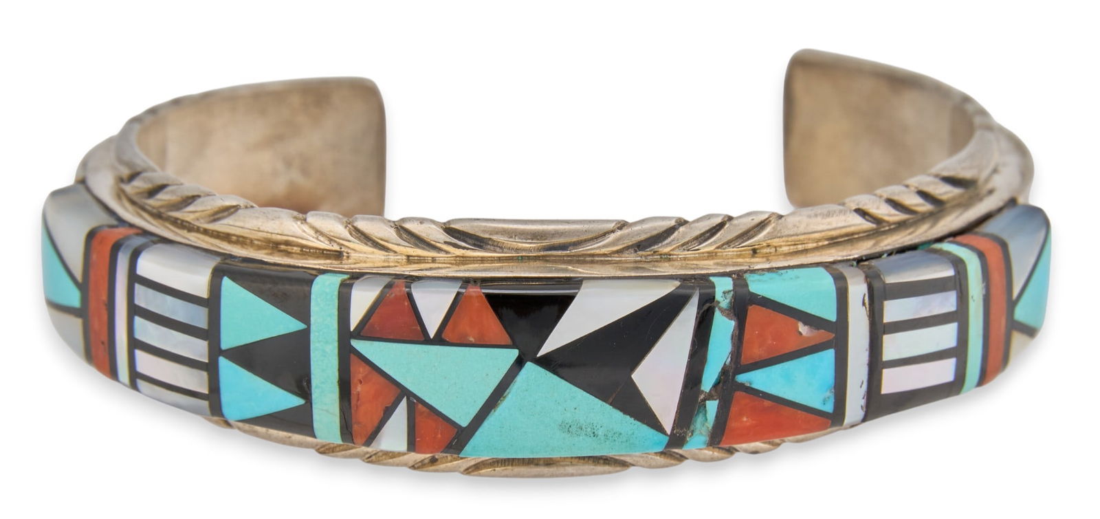 Zuni Inlay Cuff Bracelet: Zuni sterling silver cuff bracelet with geometric inlaid design, signed "Webster" and marked "Sterling"Circumference: 6.5 in. Total weight: 1.53 oztProvenance: Property from the