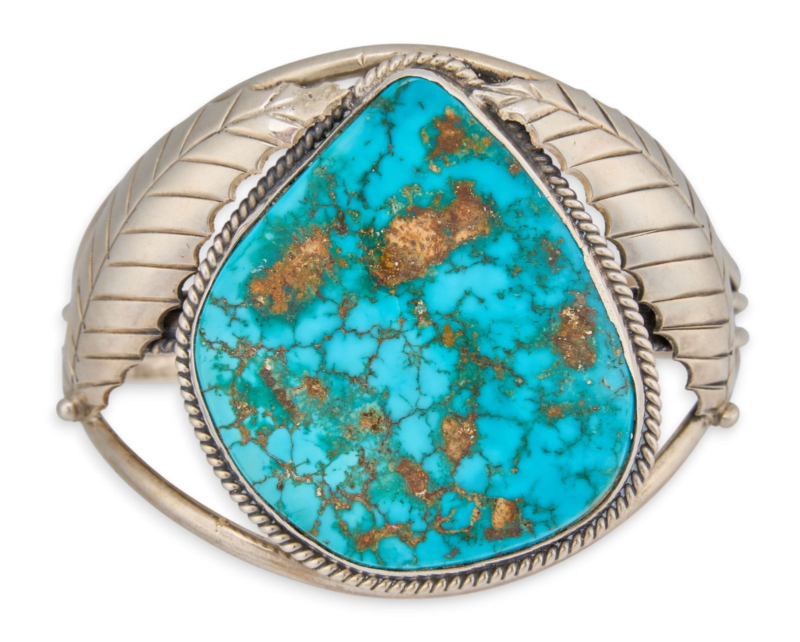 Kingman Turquoise Cuff Bracelet: Navajo sterling silver cuff bracelet with large central inlaid turquoise stone, flanked by leaf motifs and twisted rope details, marked "KEE"Circumference: 7 in. Total weight: