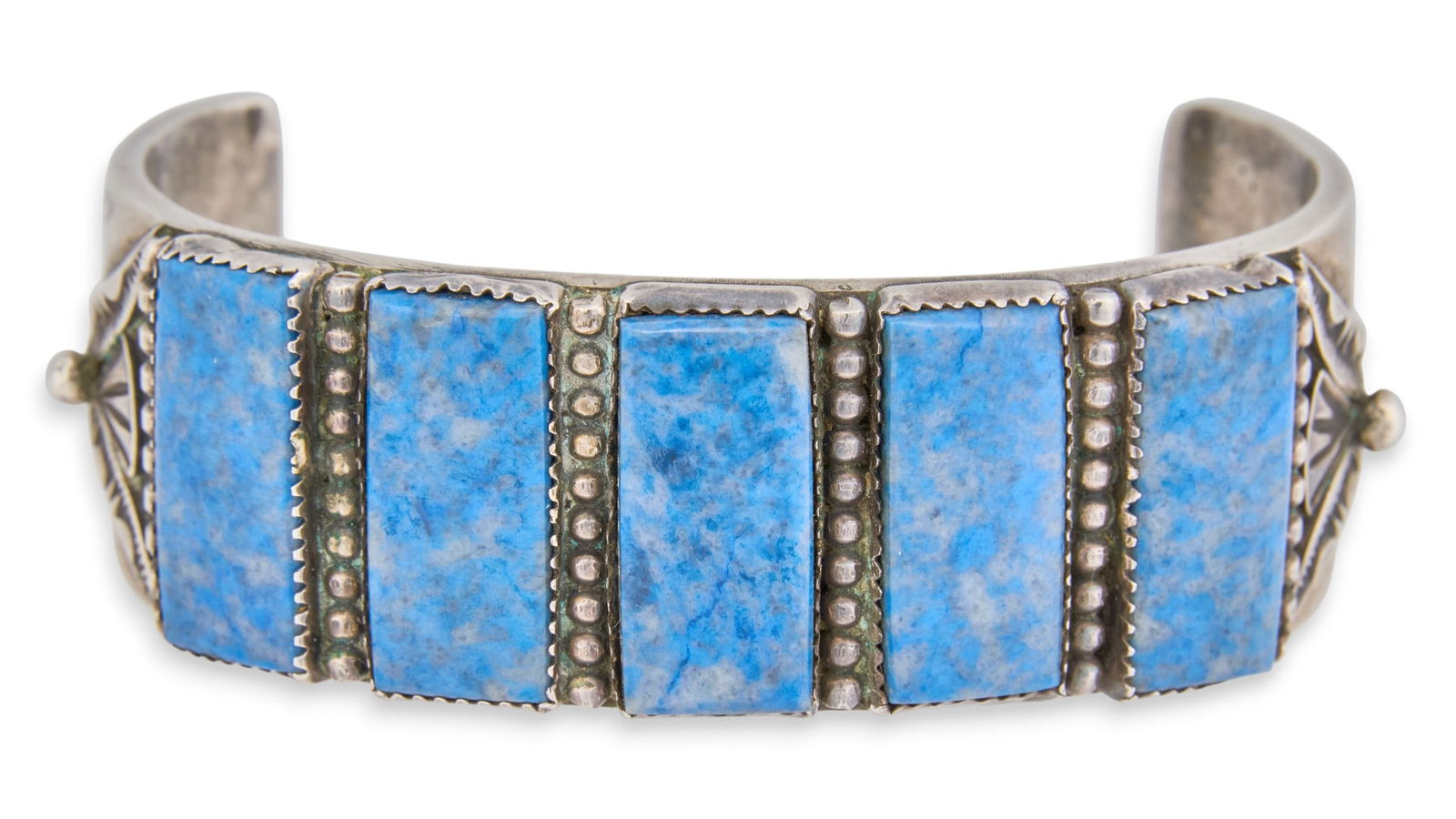 Navajo Sterling & Lapis Cuff Bracelet: Navajo sterling silver cuff bracelet with inlaid lapis stones and textured details, marked "Navajo R. Martinez Sterling"Circumference: 7.25 in. Total weight: 3.46 oztProvenance: Property