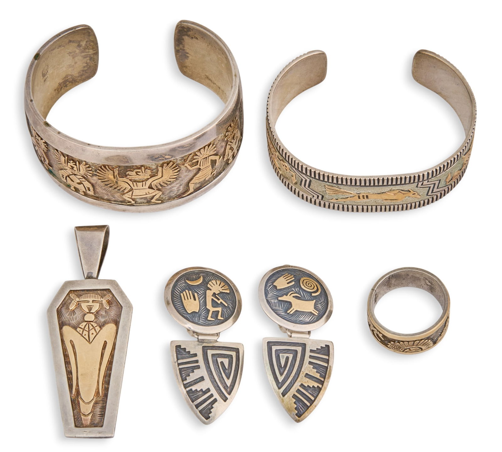 14K & Sterling Silver Jewelry Suite: 14K yellow gold and sterling silver jewelry suite to include two cuff bracelets, pair of clip-on earrings, pendant, and ring, each marked "Sterling" and "14K", and marked