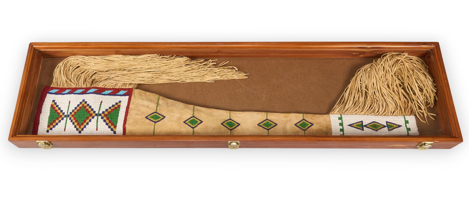 Cased Native American Plains Indian Rifle Scabbard: Native American Plains Indian rifle scabbard with beaded and tanned deer skin, with fringe tassels, housed in light oak glass top rifle case made by Tex-Star Woodworksheight 48 in. x width