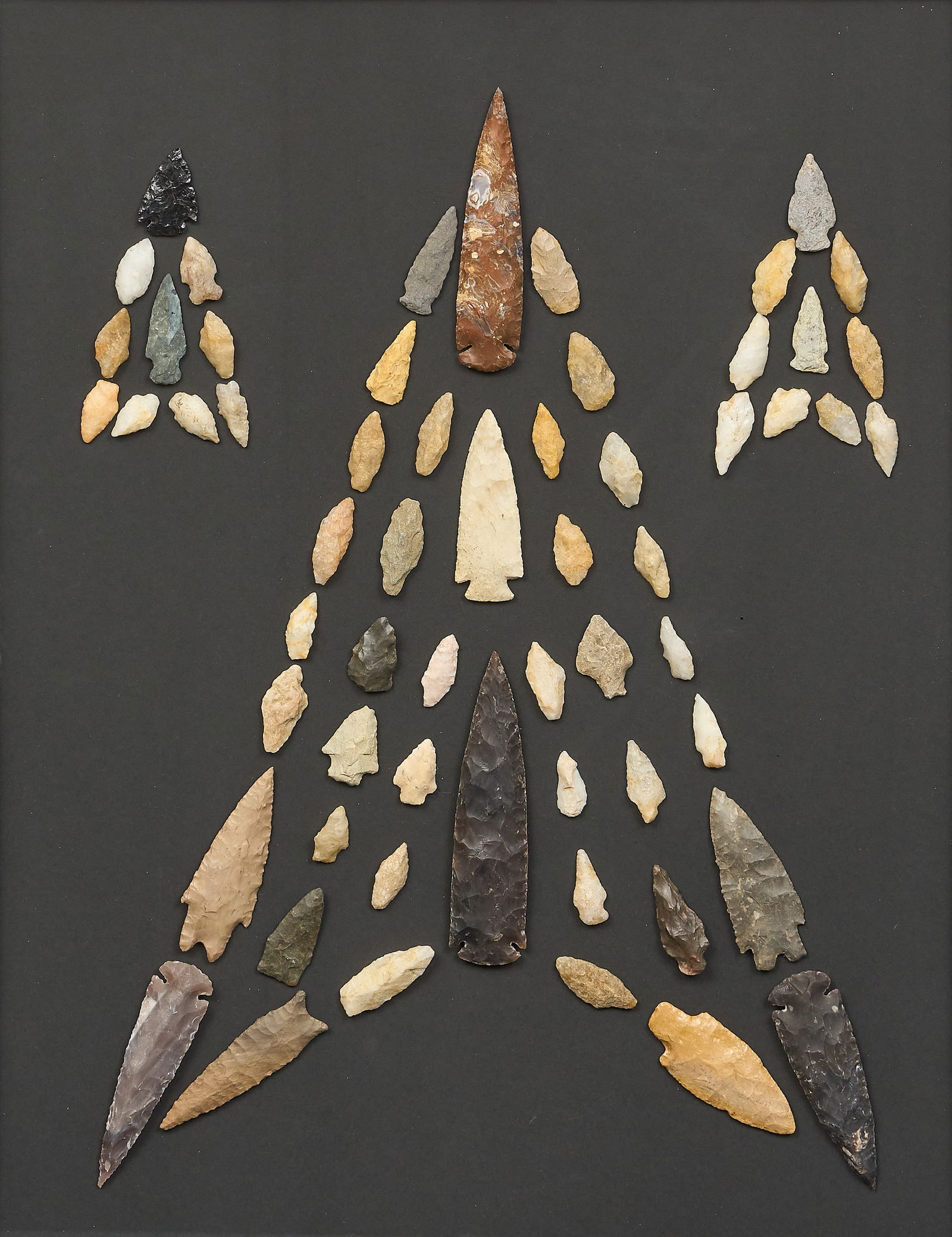 Arrowhead Display, "Arrow Flight": Arrow Flight, Jerry Bostic (San Antonio, Texas, 20th century), 2025, framed collection of pre-1500 AD stone projectile points, signed on verso frame: 30 x 30 in.Provenance: