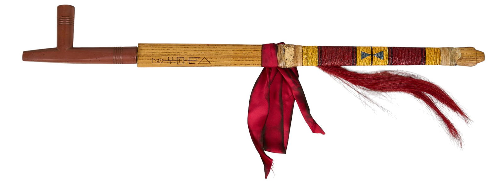 Catlinite Pipe Bowl and Stem: Native American style wooden pipe with replaced catlinite bowlProvenance: Property from a Boerne, Texas antiques collector