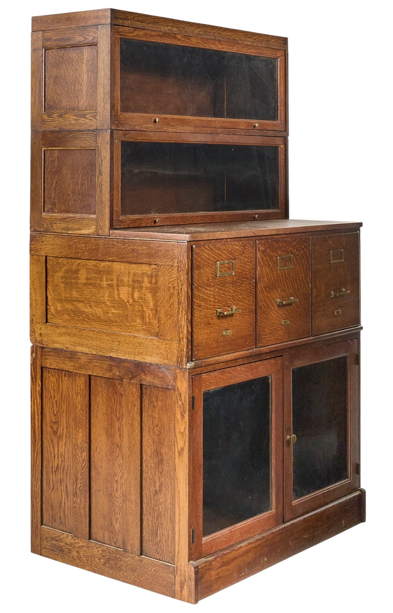 Vintage Rustic Bookcase: Vintage bookcase with two tiers of glass-front cabinets, three filing drawers, and bottom pair of glass-front cabinet doors opening to storage height 70 in. x width 39.5 in. x depth 26.5 in. Provenanc