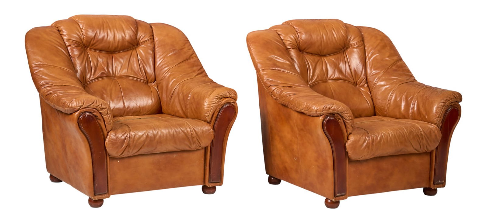 Pair of Leather Club Chairs: Pair of club chairs with orange-brown leather upholstery, supported on bun feetheight 37 in. x width 41 in. x depth 36 in. 