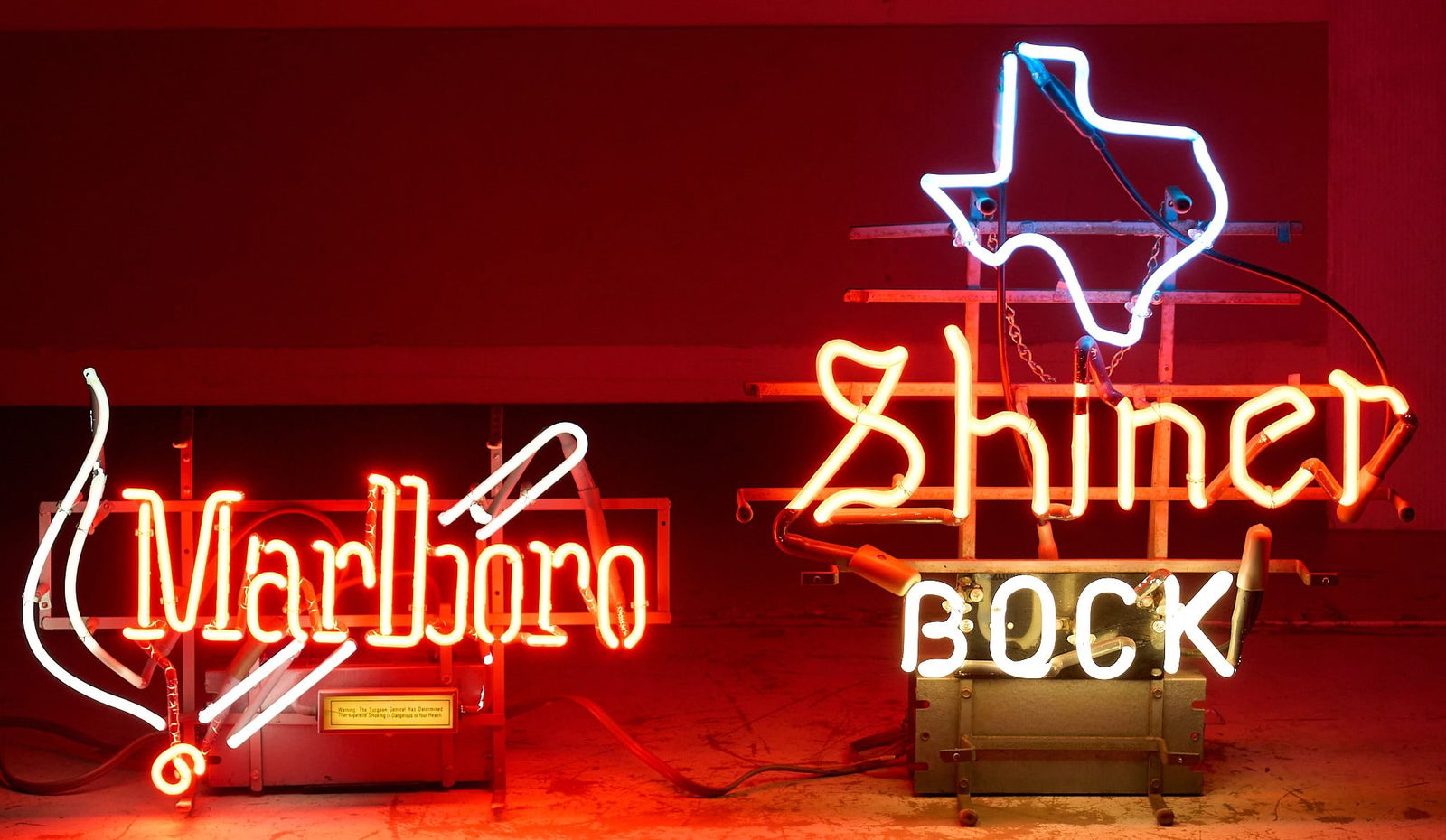 (2) Vintage Neon Signs, 20th C.: Two vintage neon signs, one for Marlboro cigarettes, and one for Shiner Bock beer with Texas design, both circa 20th century height 24 in. x width 21 in. x depth 7 in. Provenance: Property