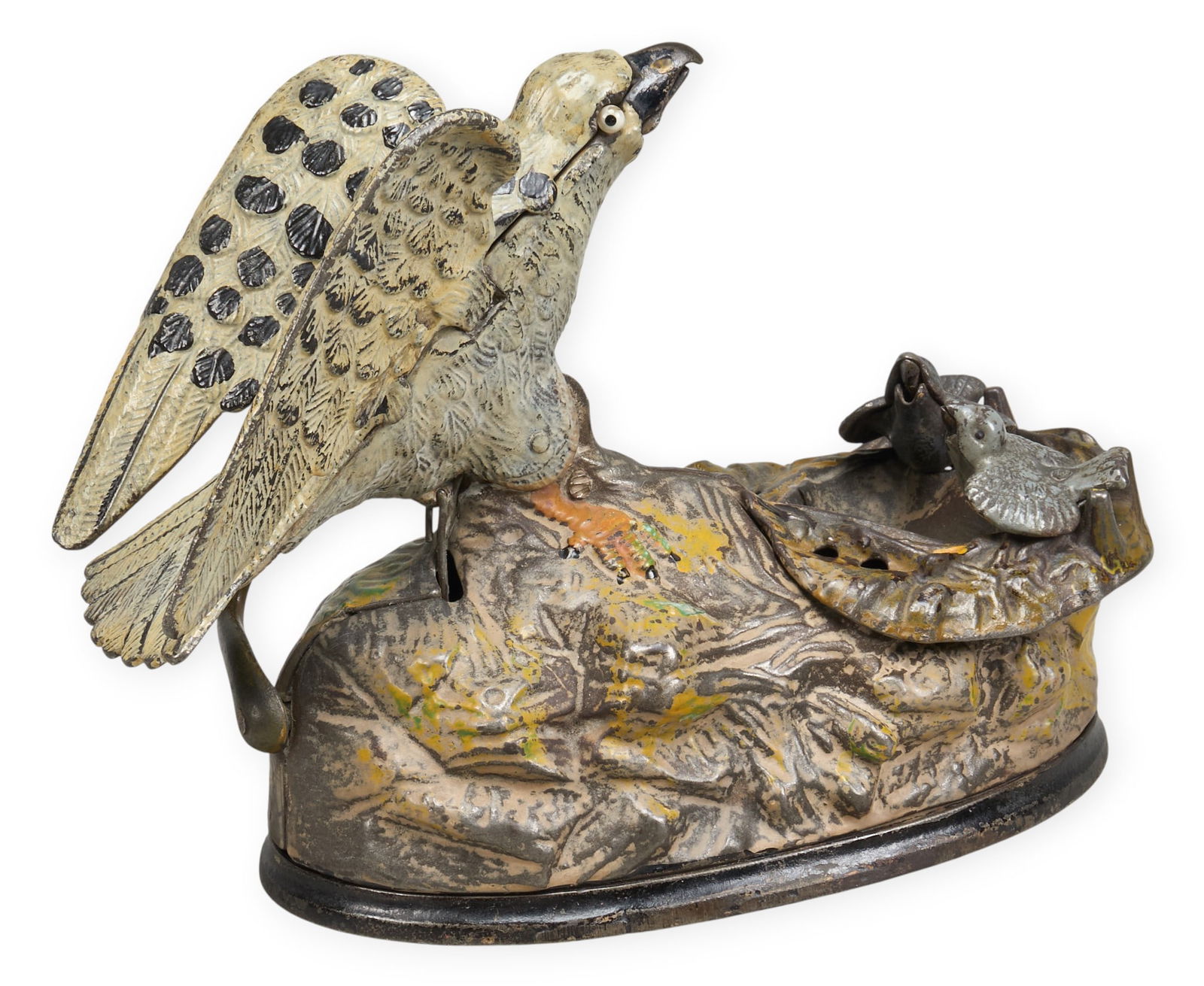 Eagles & Eaglets Coin Bank: Articulated cast iron bank with eagle nest design, manufactured by J & E Stevens Company, circa 1883height 6 in. x width 8.5 in. x depth 4.5 in. Provenance: Property from a home in San