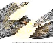 Eagles & Eaglets Coin Bank: Articulated cast iron bank with eagle nest design, manufactured by J & E Stevens Company, circa 1883height 6 in. x width 8.5 in. x depth 4.5 in. Provenance: Property from a home in San