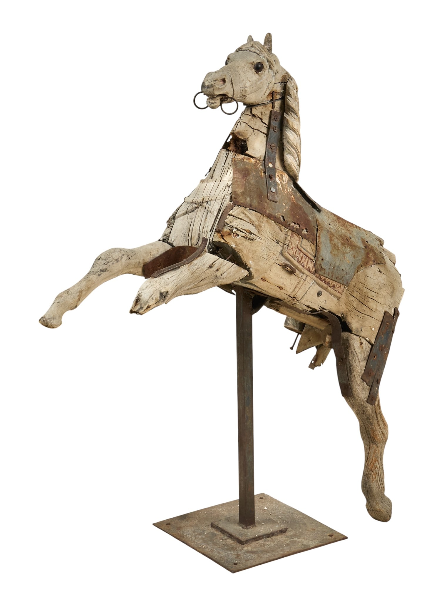 Antique Carved Wood Carousel Horse on Stand: Antique carved wood carousel horse, mounted on metal standheight 41 in. x width 34 in. x depth 11 in.Provenance: Property from a home in Dallas, Texas