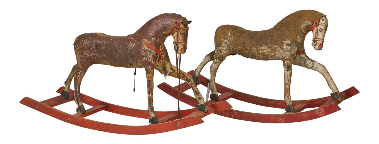 (2) Distressed Rocking Horses: Two vintage, distressed wooden rocking horses, with stuffed canvas bodies on wooden rockersheight 25 in. x width 45 in. x depth 14 in. 