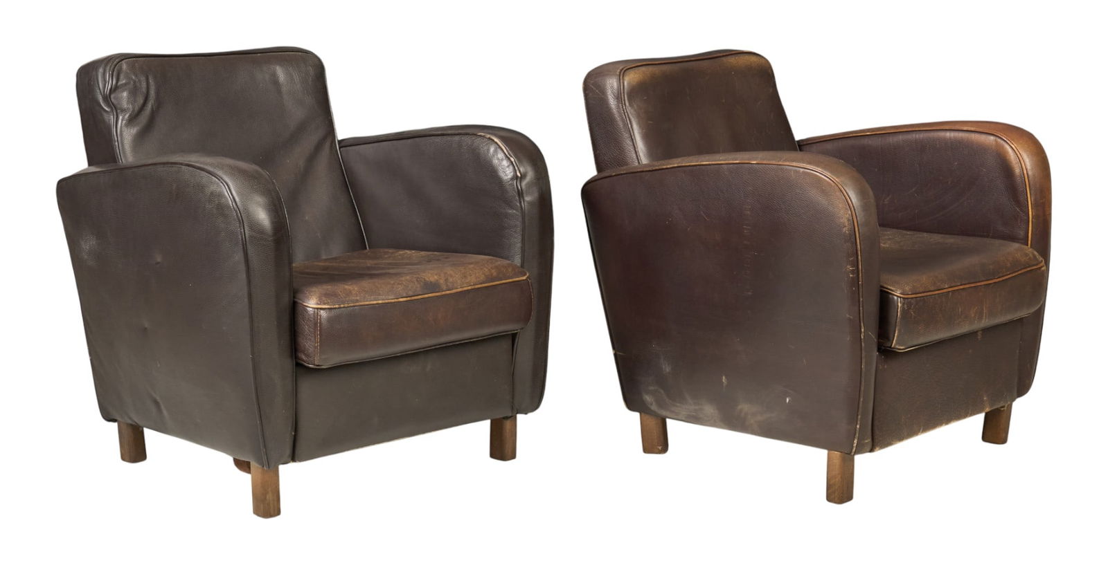 Pair of Baxter Leather Armchairs: Pair of Baxter armchairs with distressed brown leather, supported on block legsheight 32 in. x width 31 in. x deph 34 in. / each 