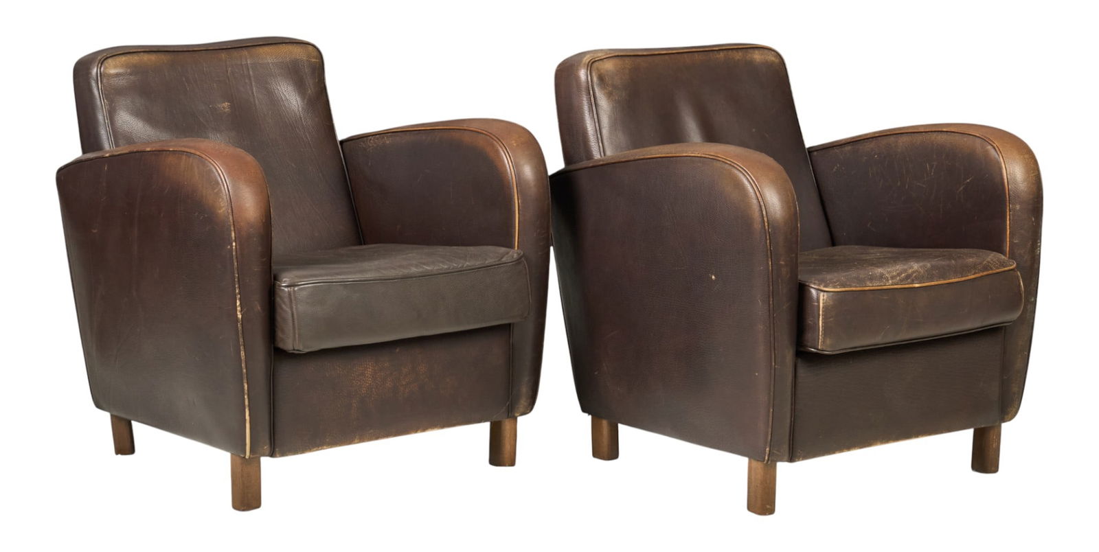Pair of Baxter Leather Armchairs: Pair of Baxter armchairs with distressed brown leather, supported on block legsheight 32 in. x width 31 in. x deph 34 in. / each 
