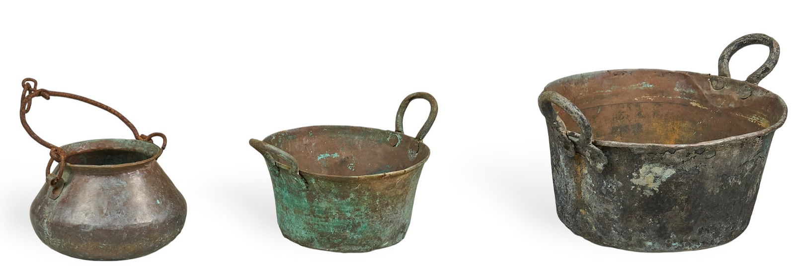 (3) Vintage Copper Cauldrons: Three vintage copper cauldrons with dark patina, and iron handles height 12 in. x width 19 in. x depth 15 in. / largest Provenance: Property from a home in San Antonio, Texas