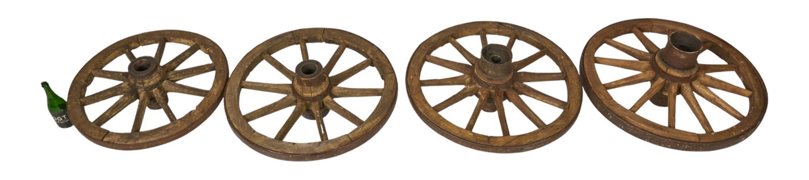 (4) Wagon Wheels: Collection of four wagon wheels height 33 in. x width 16 in. x depth 3 in. / largest 