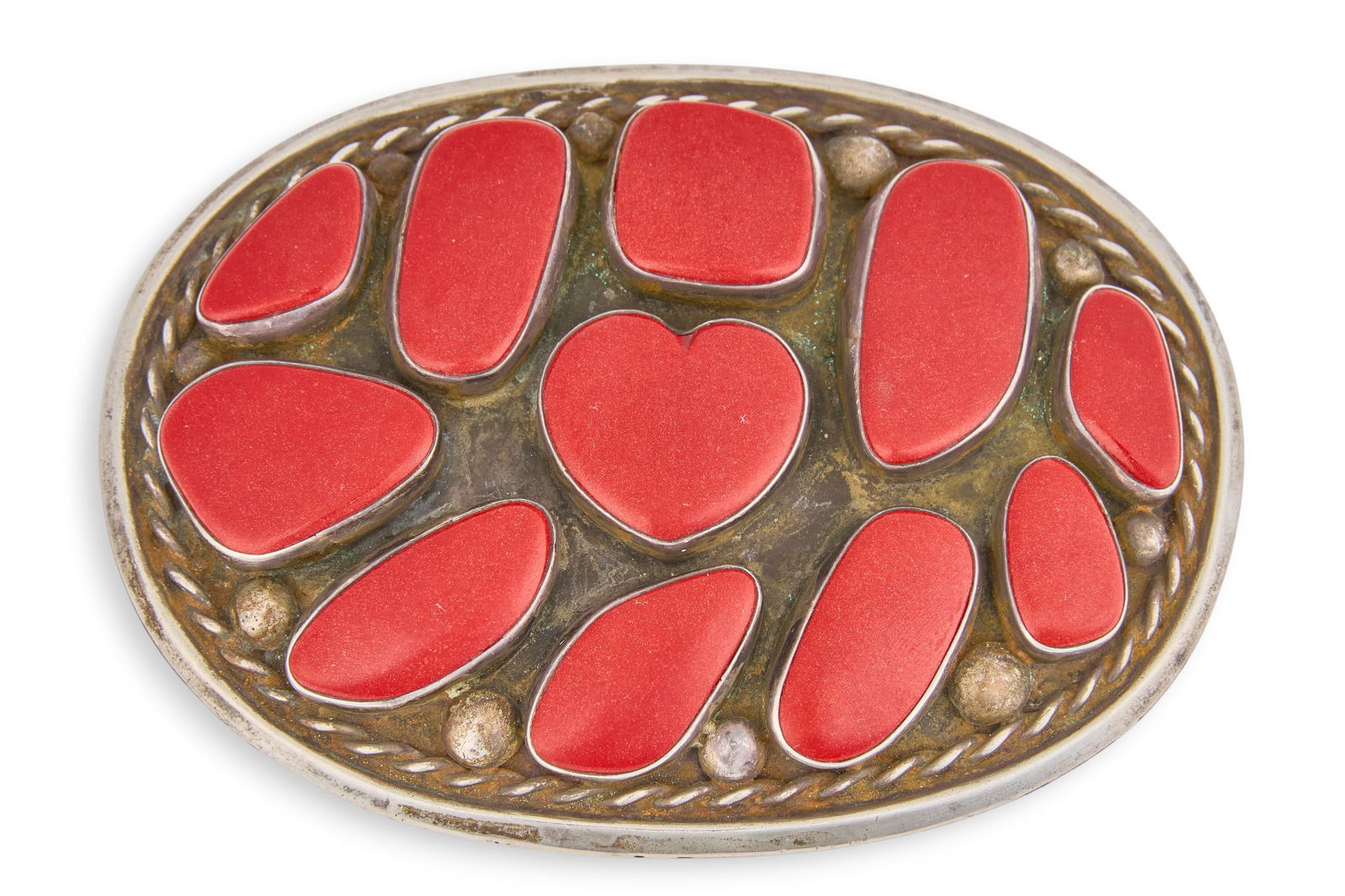 Southwestern Sterling Silver Heart Buckle: Southwestern sterling silver buckle with red stone inlay, featuring central heart motif and twisted rope details, marked "Geoff" and "Sterling", possibly by Geoff Cook Size: 3 in.