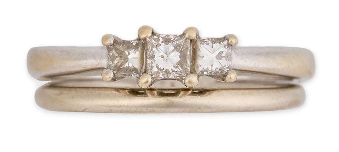 18K Diamond Engagement Ring Set: Diamond engagement ring set of two rings, with 18K white gold ring with three diamonds, marked "18K", and 14K white gold band, marked "14K" Size: 7 Total weight: 5.7