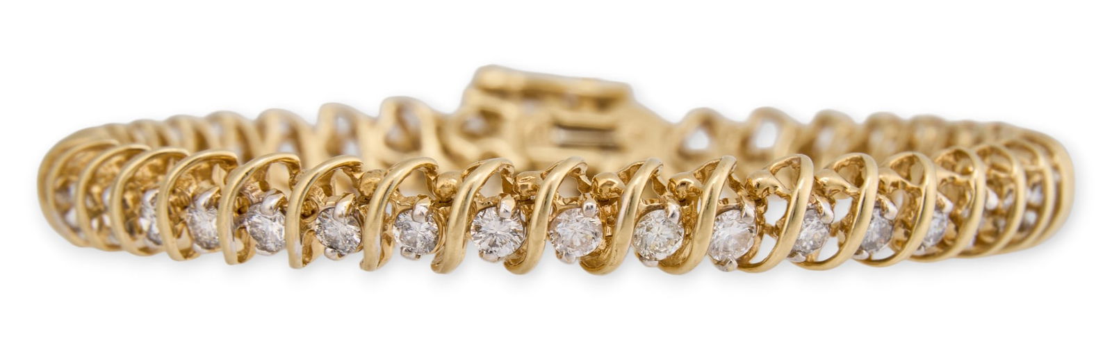 14K Diamond Line Bracelet: 14K yellow gold diamond line bracelet, with round brilliant diamonds, clasp marked "14K", with safety chainLength: 7 in. Total weight: 18.1 gProvenance: Property from a home in San Antonio,