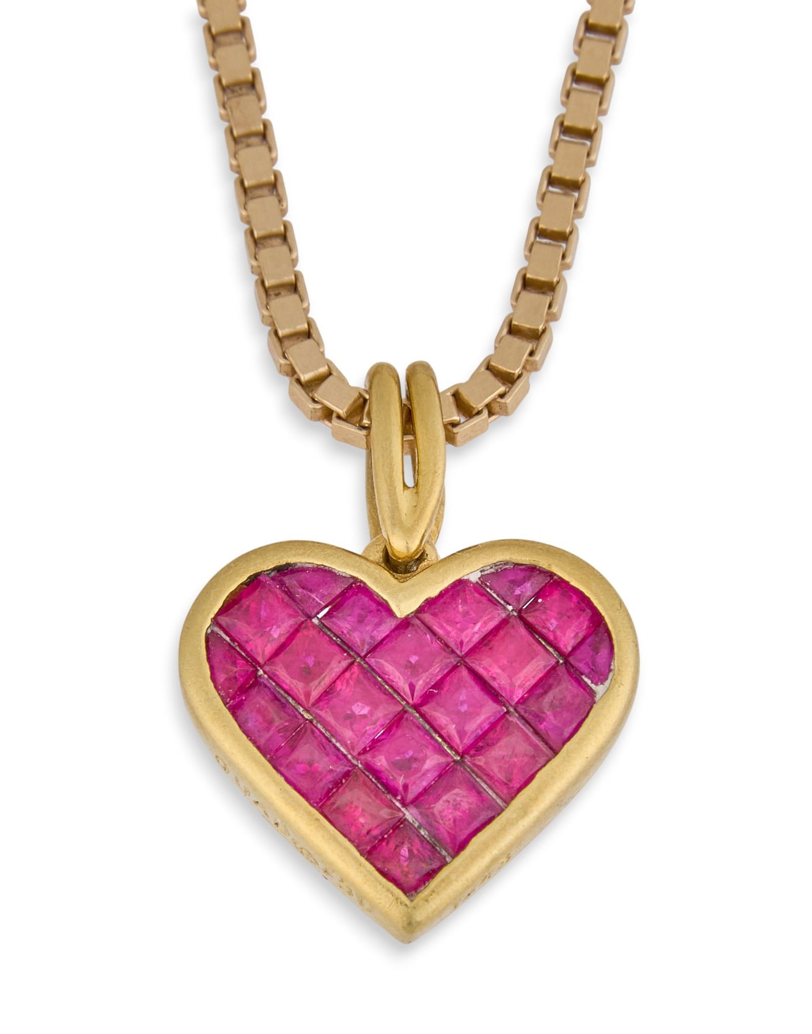 18K Ruby Heart Pendant with 14K Chain: 18K yellow ruby heart pendant with 14K yellow gold chain, marked "14K" and "Italy" near clasp, pendant marked "750" Length: 10 in. Total weight: 7.13 gProvenance: