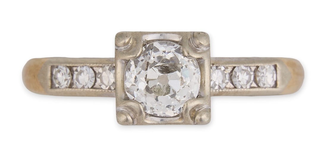 14K Engagement Ring: 14K two-tone gold (tested) diamond engagement ring, prong set Old European cut diamond (approx. 0.55ct) set in illusion style, with three single cut diamonds on the shoulders flanking the center