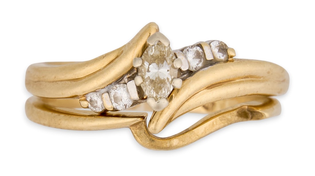 14K Diamond Engagement Ring Set: 14K yellow gold stacking engagement ring set of two rings, with marquise and round diamond details, both marked "14K"Size: 7 Total weight: 4.9 gProvenance: Property from a home in San