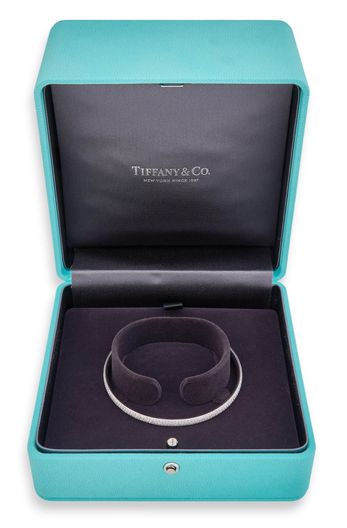 Tiffany & Co. 18K Metro Diamond Bangle: Tiffany & Co. 18K white gold Metro bangle bracelet, with three rows of pave diamonds, includes original Tiffany box, marked "Tiffany & Co. 750 Belgium"Circumference: 7.5 in. Total