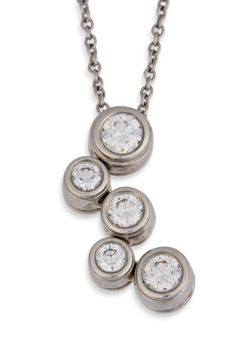 Tiffany & Co. Platinum & Diamond Bubbles Pendant Necklace: Tiffany & Co. Bubbles five-stone diamond pendant necklace in platinum, pendant and chain marked "Tiffany & Co." and "PT 950"Length: 16 in. Total weight: 4.8 gProvenance:
