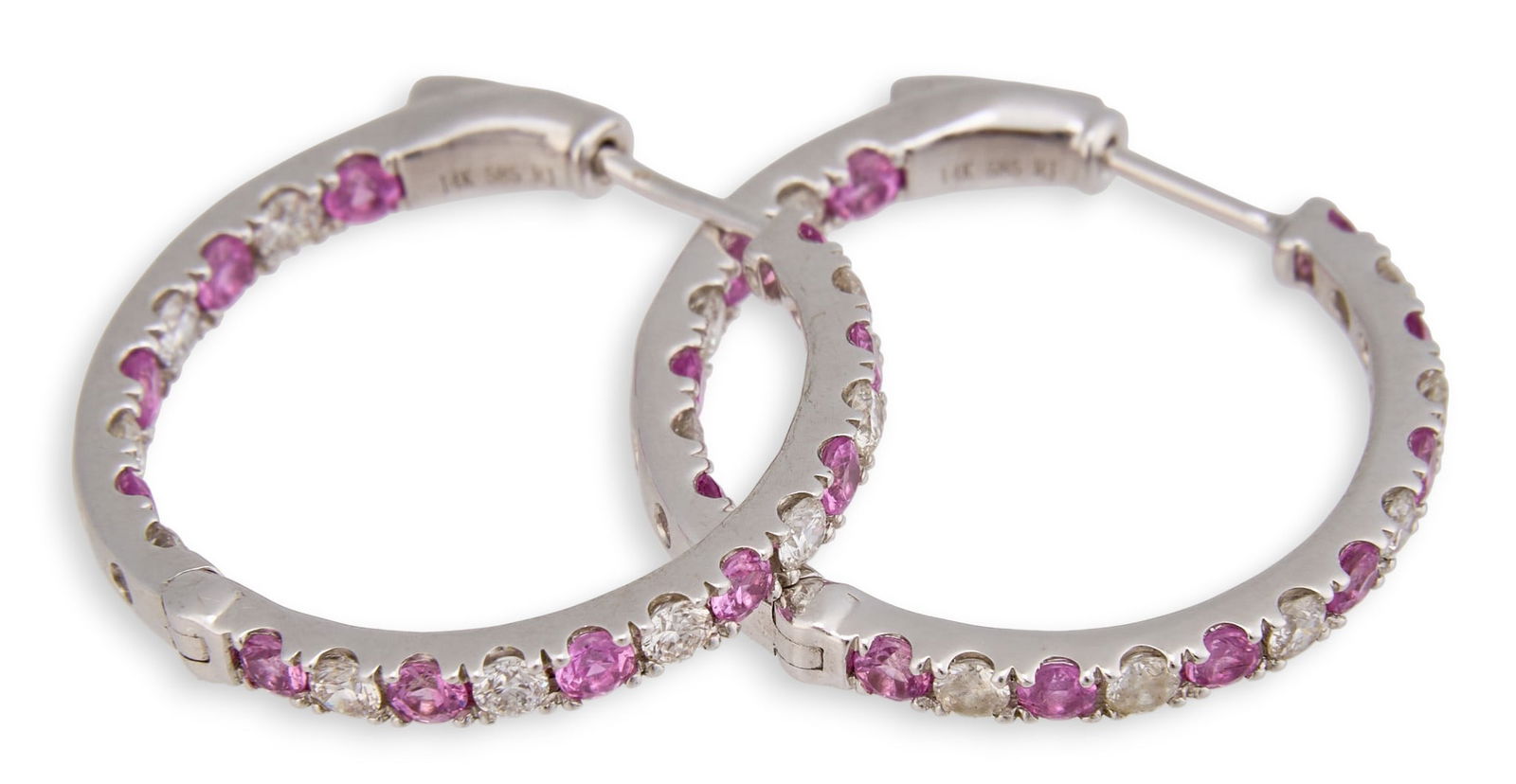 14K Diamond & Pink Sapphire Hoop Earrings: Pair of 14K white gold hoop earrings, each set with alternating pink sapphires and round brilliant-cut diamond accents, marked “14K 585.”Total weight: 3.8 gProvenance: Property from