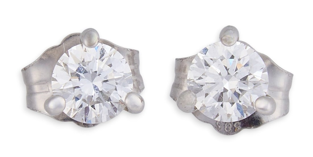 Pair of 14K Diamond Stud Earrings: Pair of 14K white gold stud earrings, each set with a round brilliant-cut lab-grown diamond in four-prong settings, complete with matching backs, marked “14K.”Total weight: 0.6