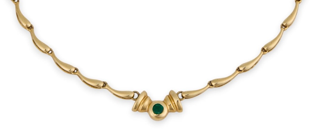 14K Emerald Necklace: 14K yellow gold teardrop chain necklace, with round emerald detail, clasp and pendant marked "14K" Length: 16 in.Total weight: 11.8 g Provenance: Property from a home in San Antonio, Texas