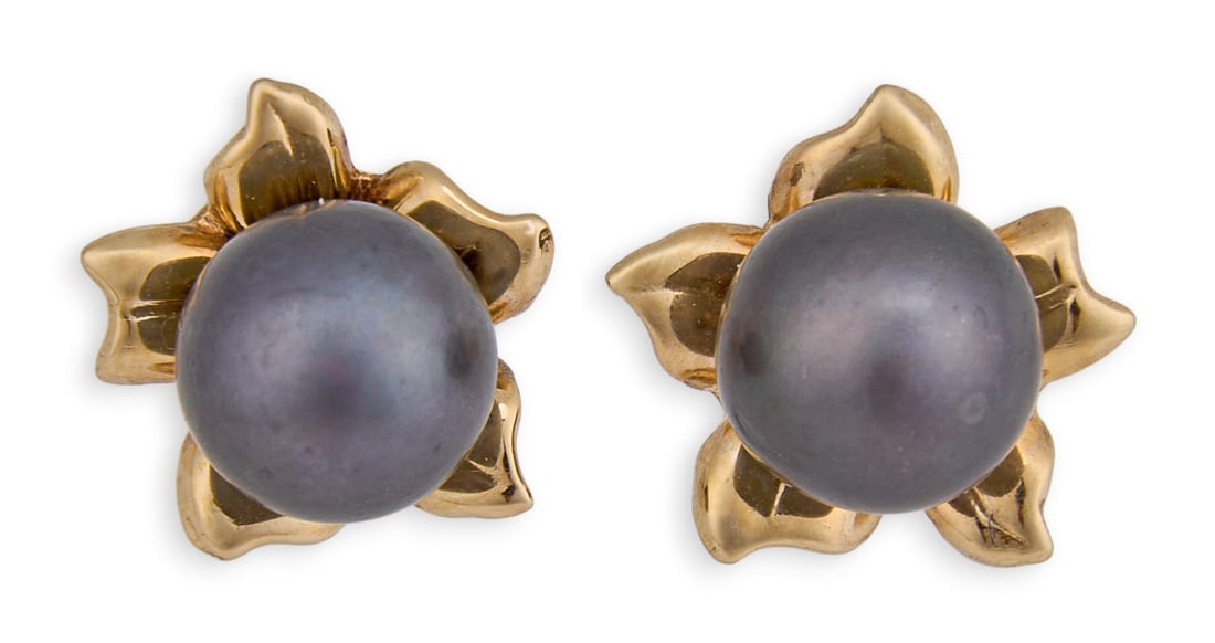 14K Black Pearl Studs: Pair of 14K yellow gold earrings with black pearl and floral motif, marked "14K" to postsTotal weight: 1.9 gProvenance: Property from a North San Antonio, Texas collection