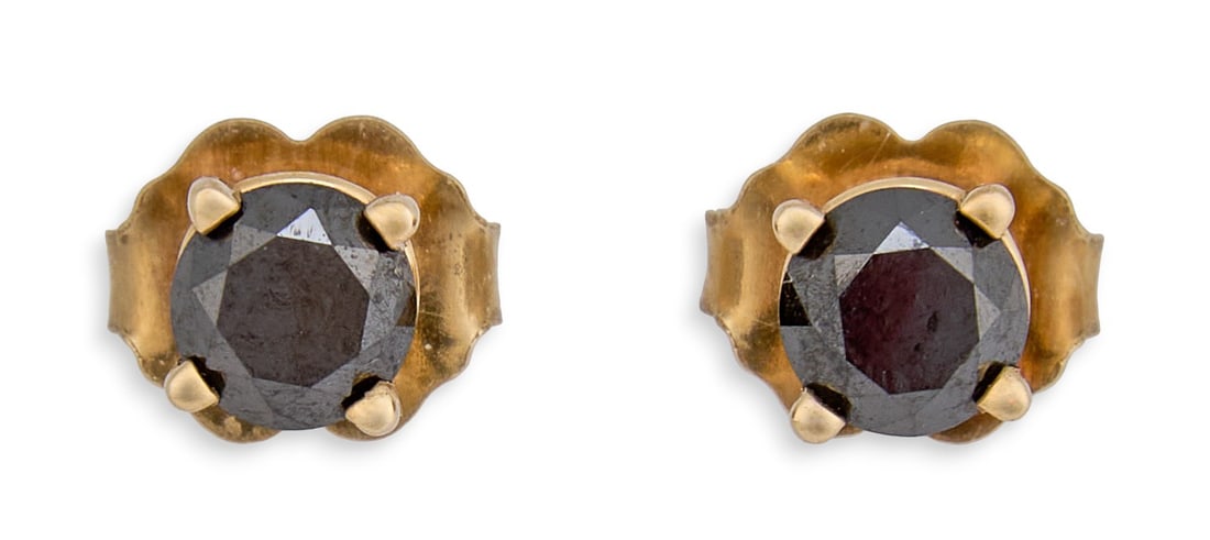 Pair of 10K Black Diamond Stud Earrings: Pair of 10k yellow gold black diamond stud earrings, with backs, marked "10k"Total weight: 0.6 gProvenance: Property from a North San Antonio, Texas collection