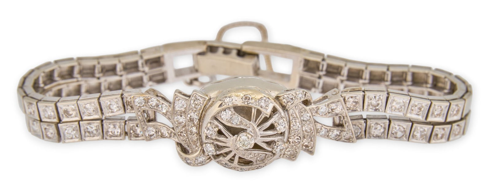 14K Diamond Filagree Bracelet: 14K white gold diamond filagree bracelet, with safety chain, marked "14K"Length: 6.5 in. Total weight: 23.5 gProvenance: Property from a home in Medina, Texas