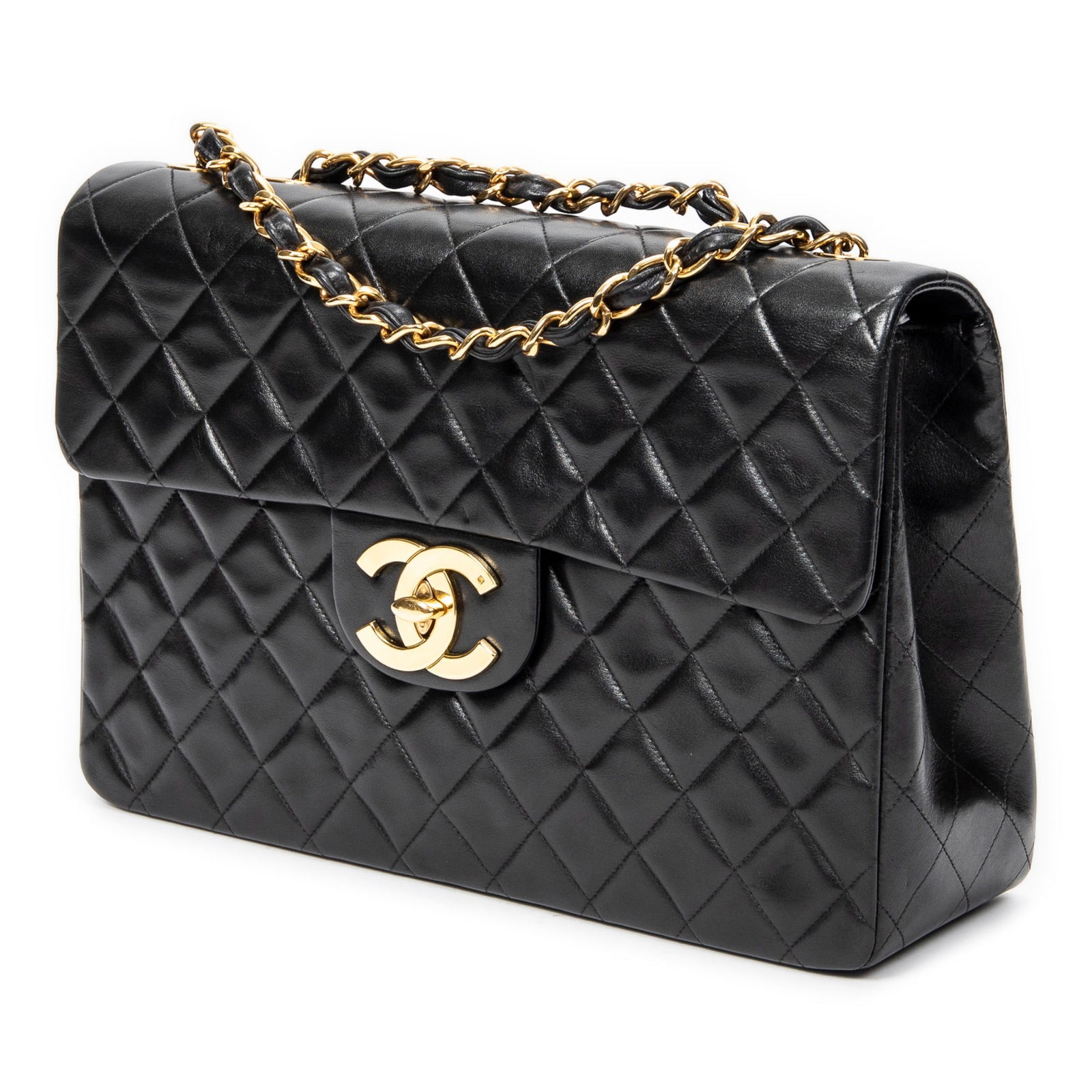 Chanel Maxi Jumbo XL Flap Shoulder Bag: Chanel Maxi Jumbo XL Flap shoulder bag in black quilted lambskin leather, with interlaced chain, golden hardware, marked 3068477 (1994-1996); third-party authenticated13.5 in. x 9 in. x 4